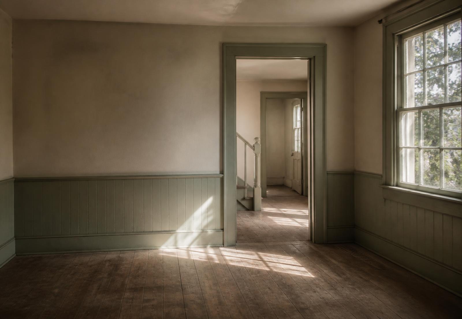 Quiet empty room with warm light on wood floors